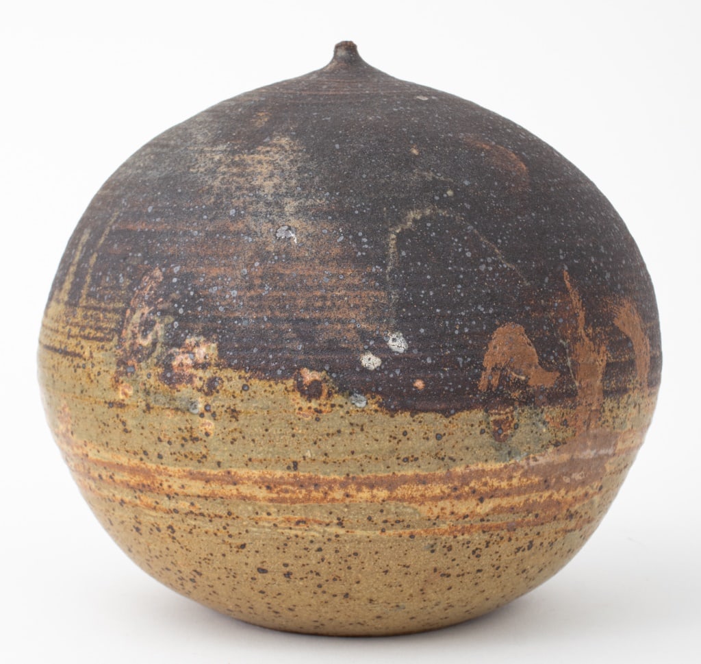 Toshiko Takaezu Glazed Closed Form with Rattle: Toshiko Takaezu (American, 1922-2011) Glazed Stoneware Open Form with Rattle, incised "TT" signature to underside. 8.75" H x 9.5" Diameter. Provenance: From 333 East 75th Street Estate. Keywords: Stud