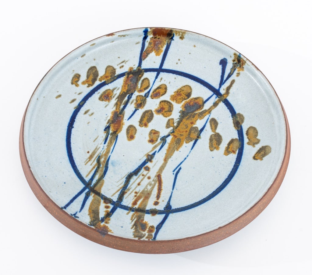 Robert Sperry Glazed Stoneware Charger: Robert Sperry (American, 1927-1998) Glazed Stoneware Charger, with cobalt blue and tan splatter to center, signed to underside. 1.75" H x 11" Diameter. Provenance: From 333 East 75th Street Estate. Ke