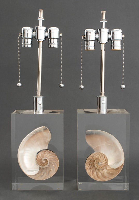Pierre Giraudon Style Nautilus Shell Lamps, Pair: Pair of Pierre Giraudon Style Nautilus Shell Acrylic Accent Lamps, shell divided in half and embedded in acrylic block, chrome dual light fixture. 20.5" H x 6" W x 4" W. Provenance: From a New York Ci