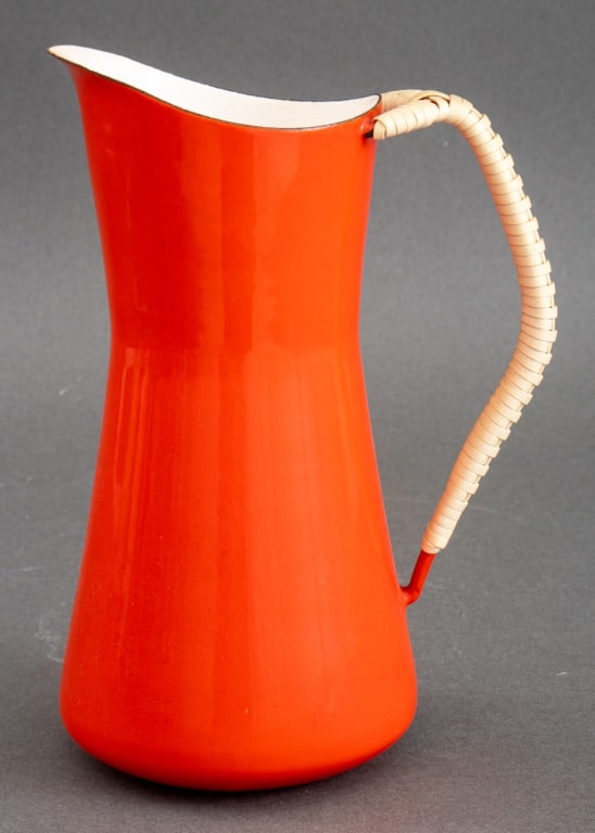Jens Quistgarrd for Dansk Kobenstyle Pitcher: Jens Quistgaard for Dansk Kobenstyle Red Enameled Pitcher, designed 1956, with wicker wrapped handle, stamped to underside with maker's mark. 8" H x 6" W x 3.25" D. Provenance: From a New York City Co