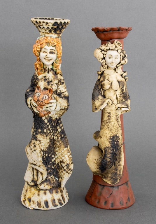 Barbara Sexton Art Pottery Figural Candlesticks, 2: Two Barbara Sexton Art Pottery Figural Candlesticks, one signed, "Barbara Sexton August 13 1990" the other apparently unsigned. 12" H x 3.25" Diameter. Provenance: From a 50 Madison Avenue Estate. Key