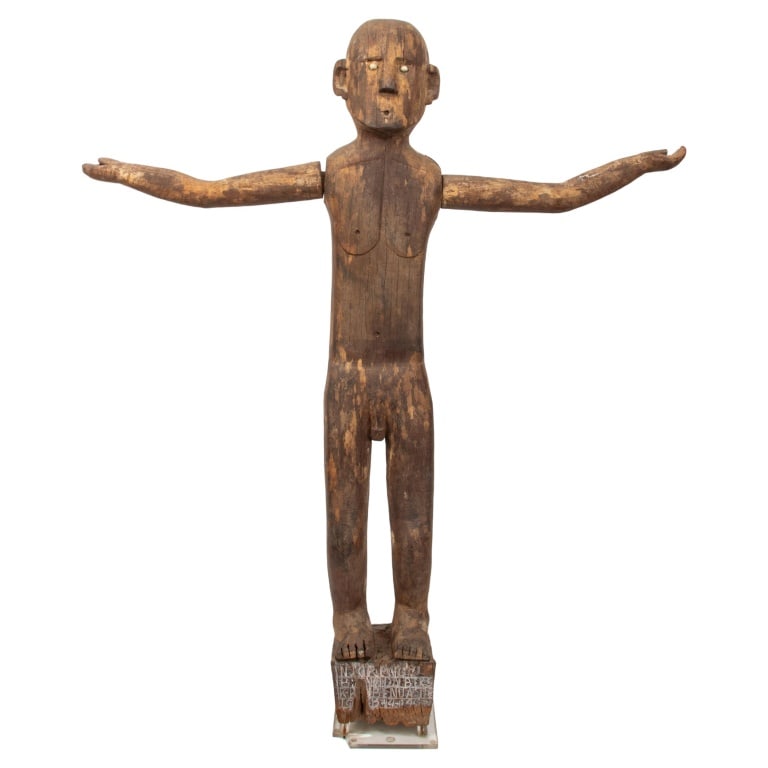 Indonesian Wood Patung Polisi Guardian Sculpture: Indonesian Wood Patung Polisi Guardian Sculpture, 19th century, West Borneo, depicting standing male figure with arms outstretched, inset white shell eyes, standing on wood base with carved letters. S