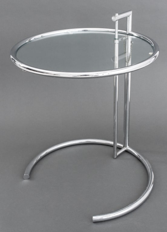 Eileen Gray E1027 Adjustable Side Table: Eileen Gray E1027 Adjustable Side Table, with tubular chrome circular adjustable top with pin and chain support on conforming base. 30" H (the support) x 20" Diameter. Provenance: From a New York City