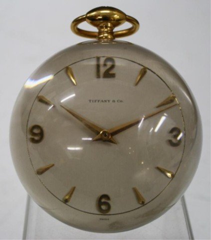 Tiffany & Co. Round Desk Clock Mid Century: Tiffany & Company round desk clock with gold toned fittings, United States, mid century; marked on face: Tiffany & Co. and Swiss; in back marked 15 Jewels, Switzerland, IMHOF, 244B6038, unadjusted. Di