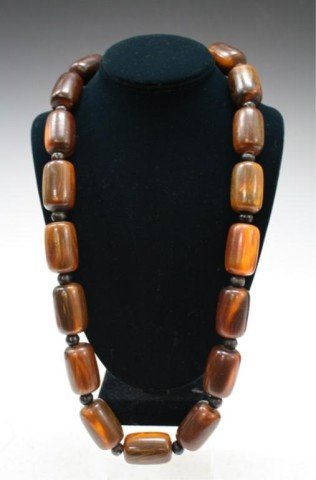 Chinese Ox Horn Beaded Necklace Jewelry: Necklace with carved ox horn large beads, China; unmarked. Dimensions: 30" L unclasped