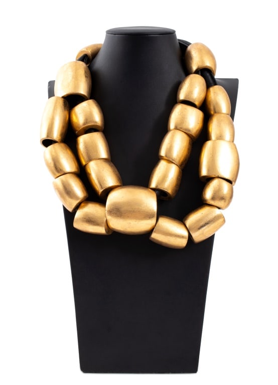 Gerda Lynggaard for Monies Gold Foil Necklace: Gerda Lynggaard for Monies Gold Foil and Leather Necklace, marked "Monies" on clasp, along with original cloth bag. 18" W (open) x 12.75" L. Provenance: From a New York City Collection. Keywords: Jewe