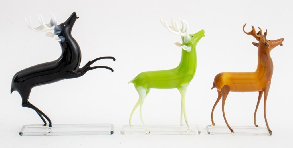 Bimini German Blown Glass Stags, 2: Group of Two Bimini German Blown Colored Glass Stags, on bases in black and chartreuse glass. 5.75" H x 4.75" L x 1.5" W. Provenance: From the Estate of fashion executive Edwin Filipowski. Keywords: S