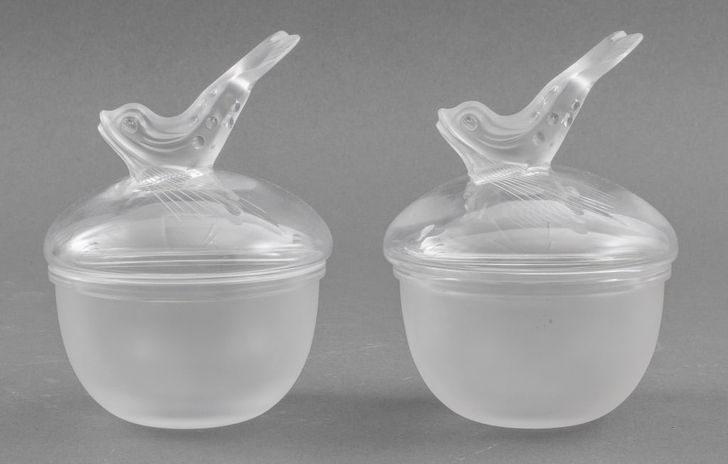 Lalique Glass Dolphin Caviar Bowl Inserts, Pair: Pair of Lalique Glass Caviar Bowl Inserts, each with a dolphin handle and frosted glass body, marked "Lalique / France" on one bowl. 6.5" H x 4.5" Diameter. Provenance: Removed from a Collection in Mt