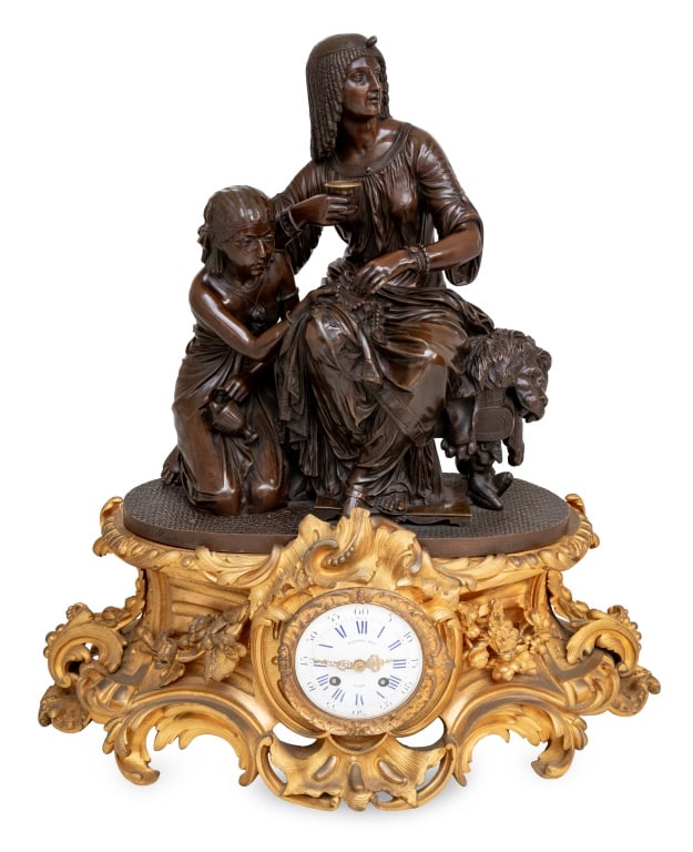 Charles Cumberworth "Cleopatra" Bronze Clock: Charles Cumberworth (French, 1811-1852) "Cleopatra et Lesbie" Patinated and Gilt Bronze Figural Mantel Clock, 19th century, cast by Marchand, the clock surmounted by the seated figure of Cleopatra and