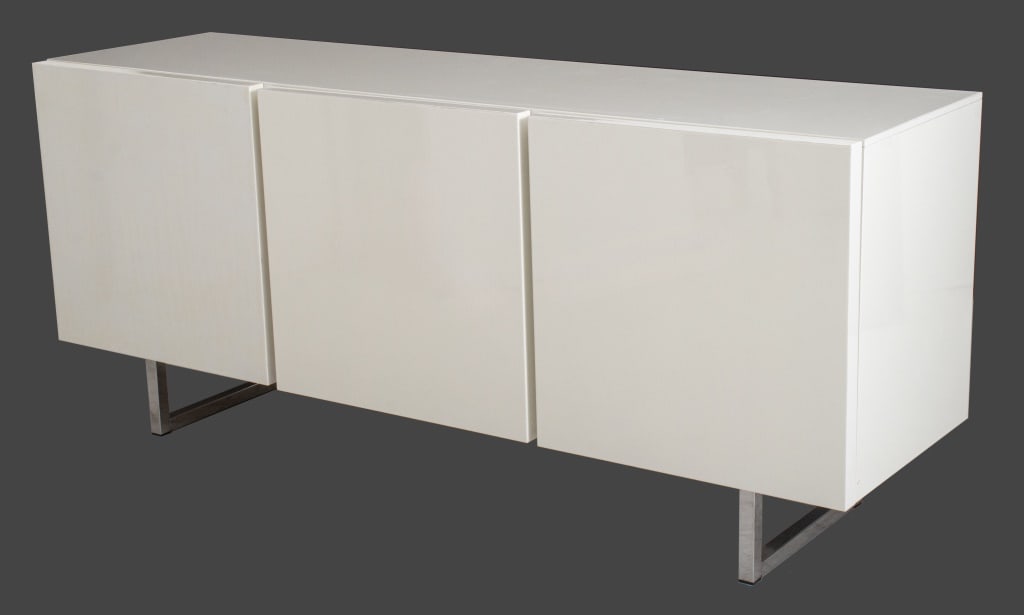 Calligaris Horizon White Lacquered Sideboard: Calligaris Horizon White Lacquered Three-Door Sideboard, with glass shelves, marked "Calligaris" to glass, chrome-plated metal base. 32.75" H x 72.5" W x 20.5" D. Provenance: From a Riverside Drive Co
