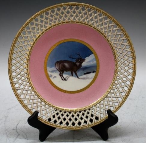 Antique Minton English Porcelain Deer Plate Dish: Antique Minton porcelain plate with white and gilt open weave latticework border and pink textured circle surrounding a blue and white winter snow scene of a deer with antlers, England; marked Minton 
