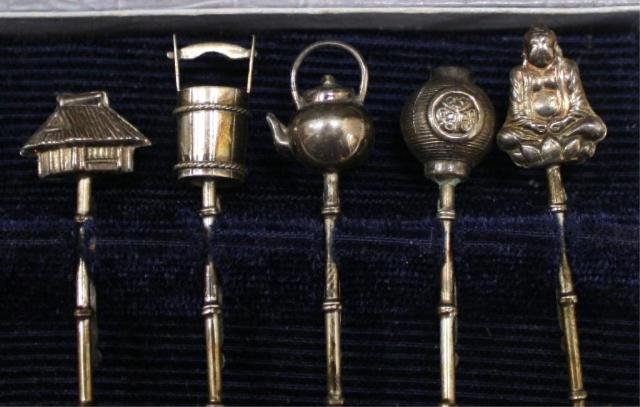 Japan Set Sterling Figural Cocktail Picks w/ Hooks: Boxed vintage set of five sterling silver novelty cocktail picks with realistic shapes on top including a mini tea kettle, a house and a Buddha, and rim hooks or clips on the backs, Japanese; hallmark