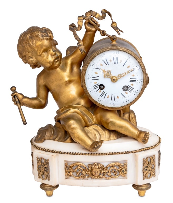Louis XVI Style "Cupid" Bronze and Marble Clock: Louis XVI Style "Cupid" Gilt Bronze and White Marble Clock, late 19th century, cupid seated on a cloud upholding the cylinder clock case, with white enamel dial, the movement strike on bell, on an ova