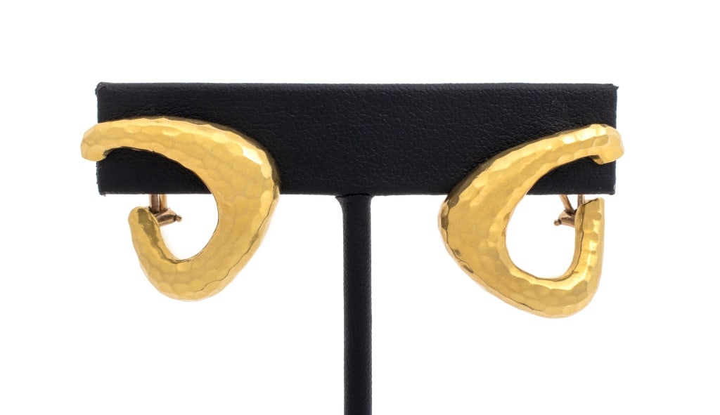 18K Yellow Gold Triangle Form Textured Earring: Pair of 18K Yellow Gold Triangle Form Hammer Textured Earrings, earring mounts on post on ear with omega clip stabilization, marked: "GCI 18K". 1" x 1" x 1/4" approx.; Weight: 10.2 dwt. Provenance: Fr