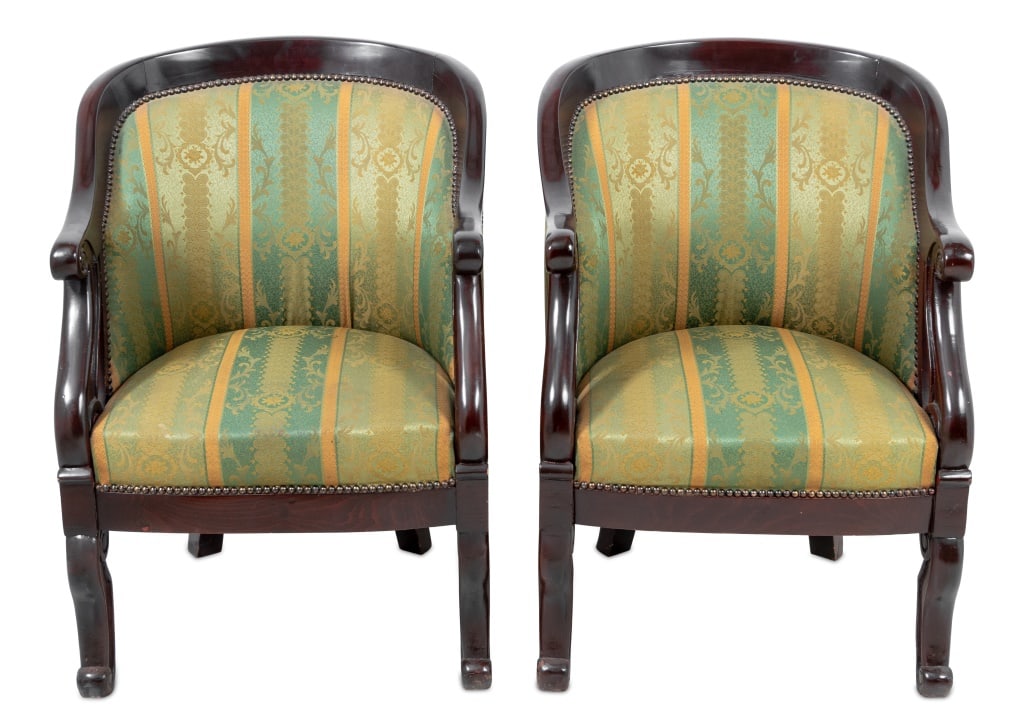 French Empire Style Mahogany Bergeres, Pair: Pair of French Empire Style Mahogany Bergeres, early 20th century, each with a rounded back and scrolled arms and supports, covered in green and gold silk, on scrolled legs. 37" H x 26.5" W x 27" D; s