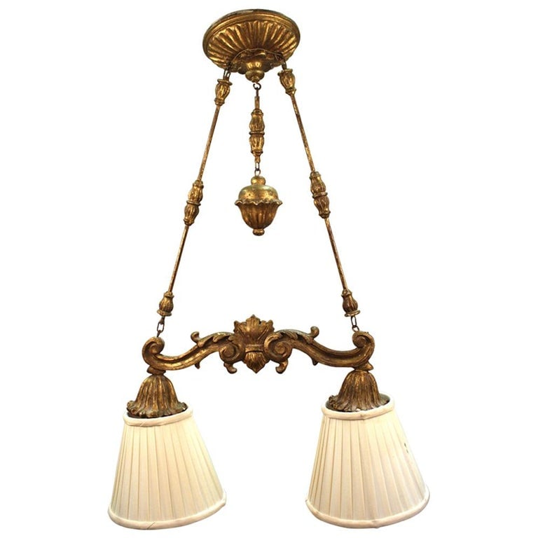 Neoclassical Revival Giltwood Pendant Light: Neoclassical Revival Giltwood Pendant Light, probably 19th century, with two pleated shades. 32" H x 23" W x 9" D. Provenance: Property from a 21 East 87th Street Estate. Keywords: Antique Lighting, C
