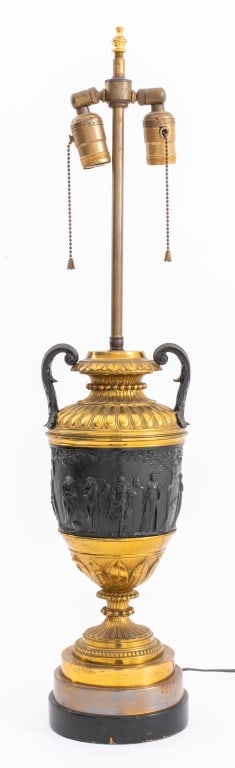 Napoleon III Style Neoclassical Urn Mounted Lamp: Napoleon III Style Neoclassical Urn Mounted as a Lamp, after Louis XVI models, the gilt brass gadrooned top above a frieze depicting Bacchic scenes on a leaf-tip cast socle above a round base. 29" H x