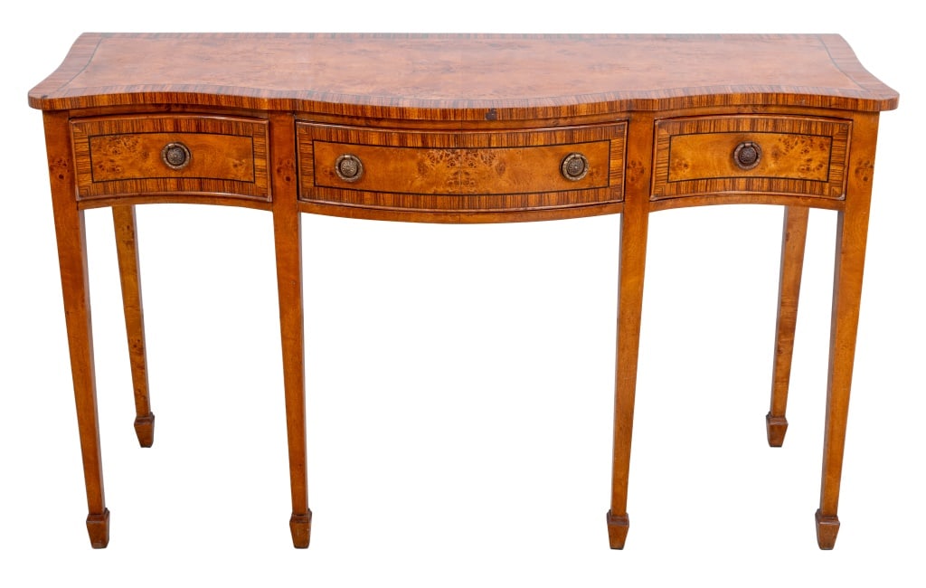 George III Style Burr Elm and Rosewood Sideboard: George III Style Burr Elm and Rosewood Crossbanded Serpentine Sideboard, 20th century, with three frieze drawers on square tapering legs with spayed feet. 31" H x 52" W x 19.5" D. Keywords: British Fu