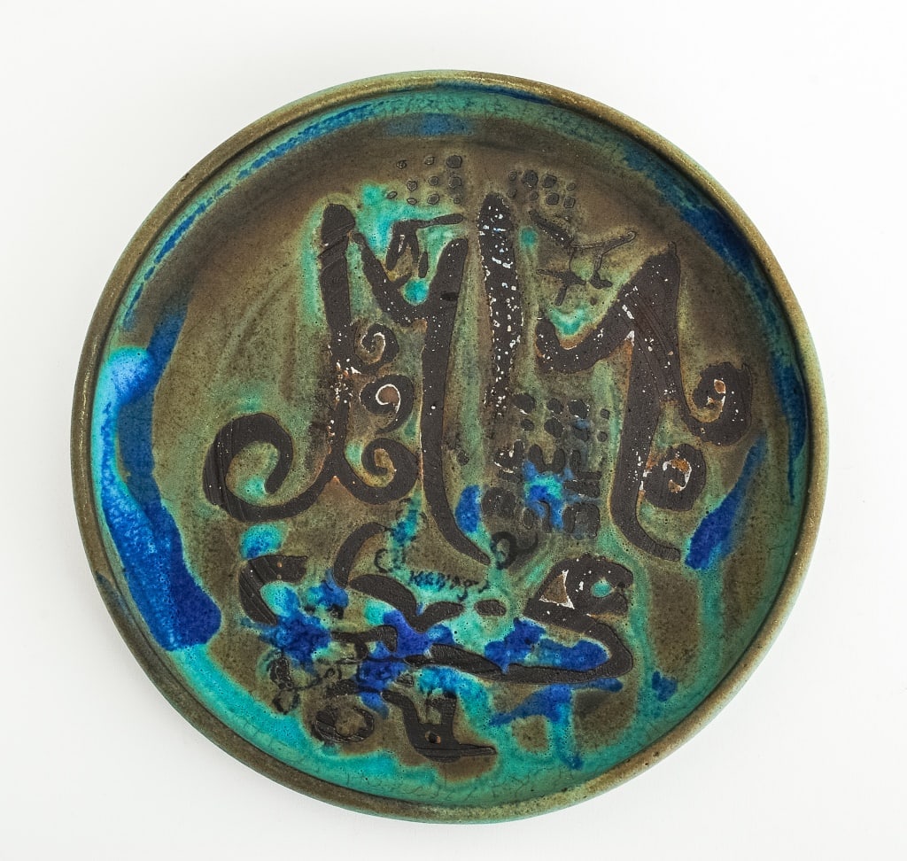 Rose Cabat Glazed Stoneware Plate: Rose Cabat (American, 1914-2015) Glazed Stoneware Plate, with abstract design to center, turquoise and cobalt blue glazes, signed to underside. 1" H x 7.75" Diameter. Provenance: From a 333 East 75th
