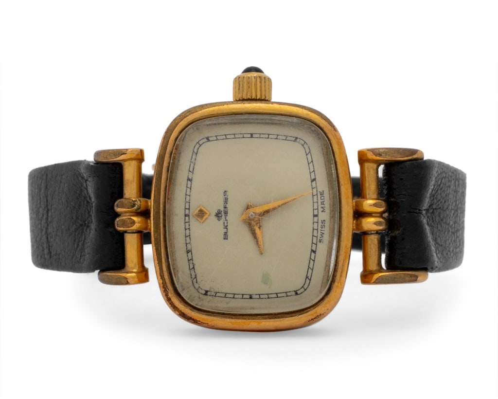 Bucherer Swiss Gold Plated Steel Wristwatch: Bucherer Swiss Gold Plated Steel Wristwatch, featuring stainless steel case with gold plated bezel, champagne dial with stick indexes, powered by 17 jewel mechanical wind-up movement, worn on the wris