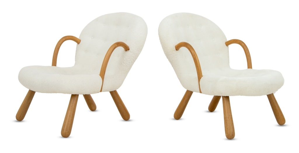 Philip Arctander Style Clamshell Chairs, Pair: Pair of Philip Arctander Style Clamshell Chairs, upholstered in white button-tufted fabric with walnut arms and four legs, unmarked. 35.5" H x 25.5" W x 34" D; seat: 15.5" H. Provenance: From an Upper