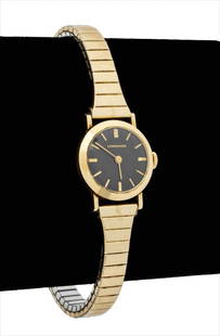 Longines 14K Yellow Gold Ladies Watch: Longines 14K Yellow Gold Ladies Watch, featuring black dial with gold hands and baton indexes, powered by mechanical wind-up movement, worn on wrist with 10K gold filled stretch band, marked: "Longine