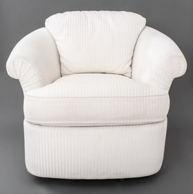Kagan Style Cream Upholstered Swivel Armchair
