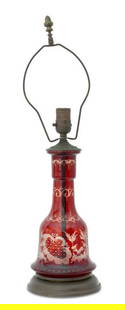 Bohemian Cranberry Glass Table Lamp: Bohemian Cranberry Glass Table Lamp, red cut to clear, etched forest scene with stag and hound. 23" H x 6.5" Diameter. Provenance: From a 33 East End Avenue Estate. Keywords: Lighting, Art Glass, Stud