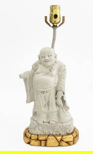 Chinese Blanc de Chine Buddha Sculpture as Lamp: Chinese Blanc de Chine Buddha Sculpture Mounted as a Lamp, atop rockwork carved giltwood base. Overall: 17.5" H x 8" W x 5" D. Provenance: From an East 72nd Street Estate. Keywords: Lighting, Asian Ar