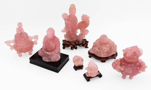 Chinese Pink Rock Crystal Sculptures, 7 Pcs.: Collection of Seven Chinese Carved Pink Rock Crystal Sculptures, comprising: seated Buddha mounted on ebonized wood base, foo lion on carved wood base, seated monkey on carved rosewood base, smiling B