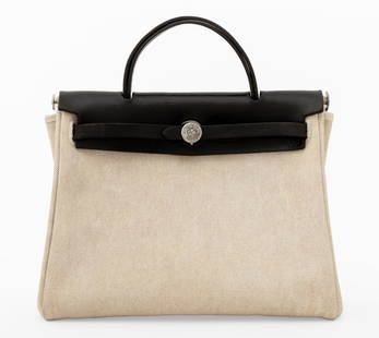 Hermes Herbag Toile Canvas & Leather Handbag: Hermes Herbag Toile Canvas and Black Leather Handbag, with silver-tone hardware, lock marked "Hermes / 127", and single interior pocket, marked "Hermes / Paris". 9.5" H x 11.75" W x 4.25" D. Provenanc