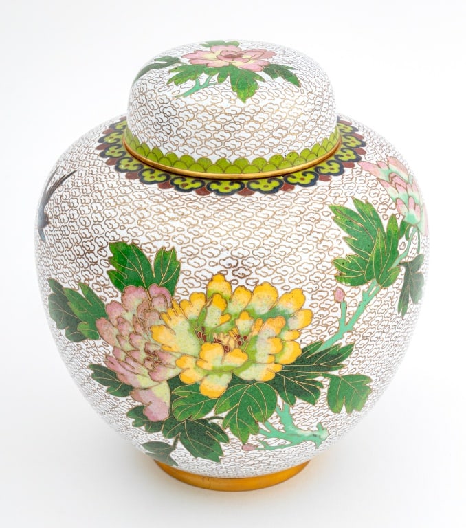 Chinese Cloisonne Covered Ginger Jar: Chinese Cloisonne Enamel Covered Ginger Jar, decorated with flowers and a bird on a white ground with cloud design, ruyi head border to rim. 9.5" H x 7" Diameter. Provenance: From a New York City Coll
