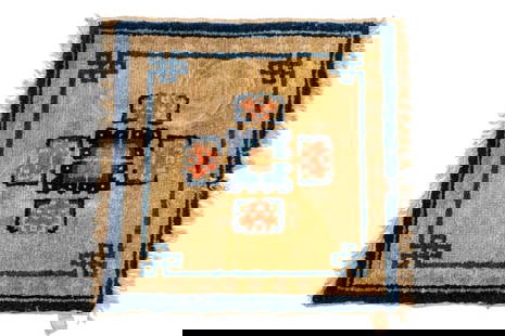 Tibetan Meditation Mat, 1' 5.5" x 1' 6.5": Tibetan Meditation Mat, early 20th century, pink and navy medallion on cream ground with navy borders Largest: 1' 5.5" L x 1' 6.5" W. Provenance: From the Upper East Side Apartment of a Former Ambassa