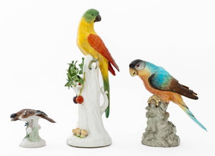 Meissen & Royal Vienna Painted Porcelain Birds, 3: Collection of Three Hand-Painted Porcelain Birds, comprising: Meissen model of a waxwing, with blue crossed swords mark to the base, Royal Vienna parrot perched on tree stump with foliage and cherries