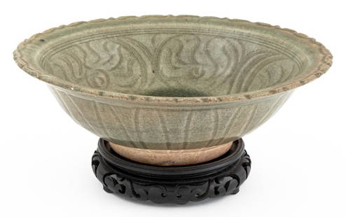 Chinese Lotus Form Longquan Celadon Glazed Bowl: Chinese Lotus Form Longquan Celadon Glazed Bowl, on ebonized carved wood stand. 3.5" H x 11.5" Diameter. Provenance: From an Upper East Side Collection. Keywords: Asian Arts, China, Pottery, Ceramics,