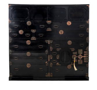 Japanese Black Lacquered Tansu, 19th C.: Japanese Black Lacquered Tansu, 19th century, in four sections, the base below two sections with drawers and lock and key doors opening to drawers surmounted by third section with four sliding doors,