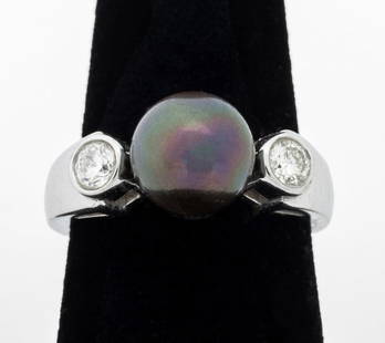 14K White Gold Tahitian Pearl Diamond Ring: 14K White Gold Tahitian Pearl Diamond Ring, featuring one round cultured Tahitian peal, further adorned with two flush set round brilliant cut diamonds weighing a total of approx. 0.50 carat, J-K colo