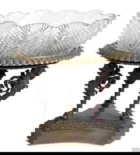 French Empire Patinated Bronze & Glass Centerpiece: French Empire Patinated Bronze and Cut Glass Centerpiece, the tri-form base with circular dish top on three lion monopodia, the glass bowl associated. 12" H x 12.5" Diameter. Keywords: French Arts, Ta