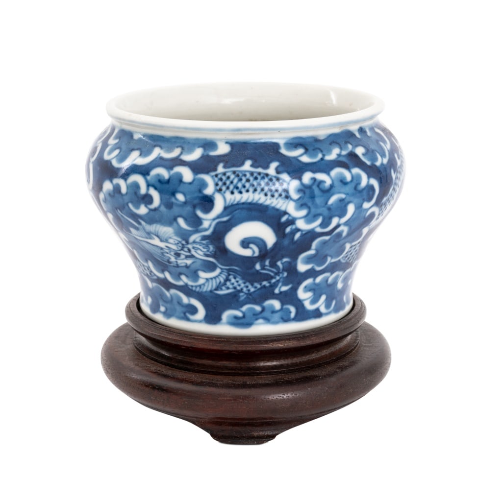 Chinese Dragon Motif Blue & White Porcelain Vase: Chinese Dragon Motif Blue and White Glazed Porcelain Vase, together with carved wood stand. Vase: 3" H x 4.25" Diameter. Provenance: From the Upper East Side Apartment of a Former Ambassador. Keywords