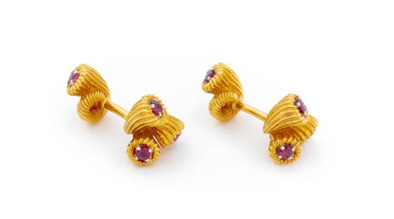 Schlumberger Tiffany & Co. Cornucopia Cufflinks: Pair of Schlumberger for Tiffany and Company Cornucopia 18K Yellow Gold Ruby Cufflinks, featuring eight prong set rubies weighing a total of approx. 1.00 carat, designed with fluted cornucopia symbols