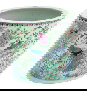 Chinese Famille Rose Porcelain Jardiniere: Chinese Famille Rose Porcelain Jardiniere, Daoguang period, with floral, peacock, and butterfly motif, four character iron red character mark to the underside. 12.25" H x 14.25" Diameter. Provenance: