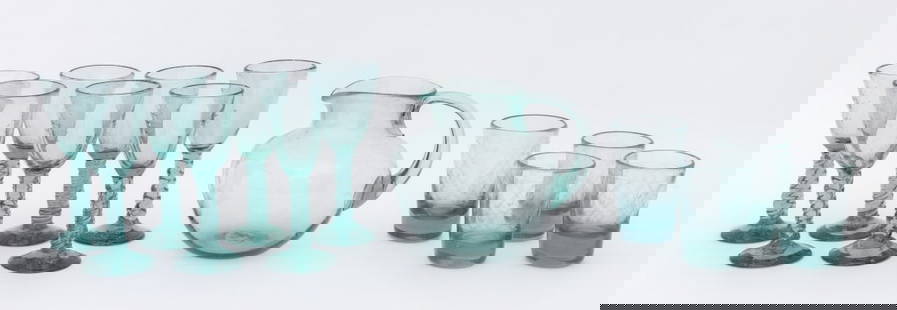 Venetian Murano Art Glass Tableware Articles, 12: Set of 12 Venetian Murano Art Glass Tableware Articles, in green tinted glass, comprising: (7) seven wine glasses with twist form stems, (4) four water glasses with etched diamond pattern design, and