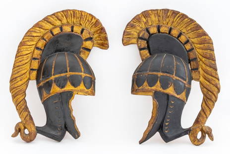 Palladio Carved Wood Spartan Helmet Appliques, Pr.: Pair of Palladio Carved Partial Ebonized and Giltwood Spartan Helmet Wall Appliques, marked "PALLADIO / Handcarved in Italy" to reverse. 11.5" H x 8" W x 1.5" D. Provenance: From a New York City Colle