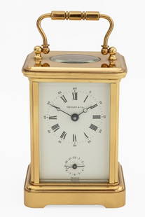 Tiffany & Co. Brass Carriage Clock: Tiffany and Company Brass Carriage Clock, with swing handle and white clock face marked "Tiffany & Co / France" and works marked "L' Epee / 1839" and "Made in France / 11 eleven jewels" to the reverse