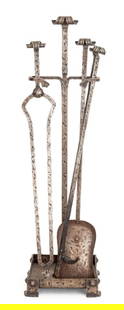 Arts and Crafts Wrought Iron Fireplace Tools Set: Arts and Crafts Wrought Iron Fireplace Tools Set, tongs, poker, and shovel in holder. 34.5" H x 9.5" W x 9.5" D. Provenance: From a Rye, New York Estate. Keywords: Fireplace accessories, Antique, Fire