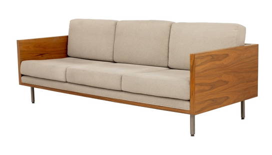 Milo Baughman Attr. Walnut Cased Three-Seat Sofa: Milo Baughman Attributed Walnut Cased Three-Seat Sofa, with six beige upholstered cushions above four aluminum tubular legs, Modernica label to the underside. 25" H x 84" W x 34.5" D; seat: 17" H. Pro