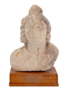 Ancient Egyptian Bust of Isis Limestone Carving: Ancient Egyptian Bust of Isis Limestone Carving, 500-300 B.C.E., the goddess wearing the double crown of Upper and Lower Egypt, with remnants of polychrome pigment, mounted atop a wood plinth with pap