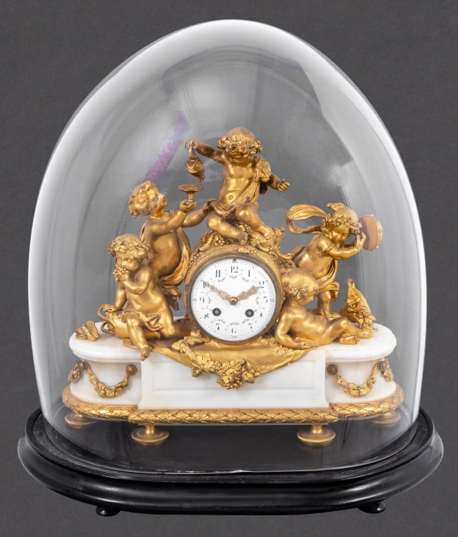 Louis XVI Style Gilt Bronze Marble Figural Clock: Louis XVI Style Gilt Bronze and White Marble "Bacchanalia" Figural Clock, late 19th century, retailed by Tiffany and Company, surmounted by five frolicking cherubs enjoying a wine festival, centered b