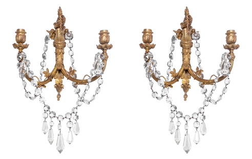 Louis XV Style Gilt Metal 2-Light Appliques, Pair: Pair of Louis XV Style Gilt Metal Twin Light Appliques, late 19th century, each centered by a cherub upholding a torch, issuing scrolled foliate branches, suspended with graduated glass prisms and