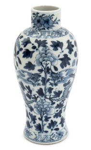 Chinese Blue and White Dragon Porcelain Vase: Chinese Blue and White Dragon Motif Porcelain Vase, two dragons on floral ground, four character mark to underside. 9" H x 3.75" Diameter. Provenance: From an East 72nd Street Estate. Keywords: Asian